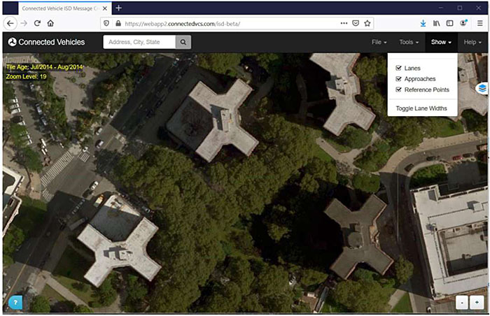 The slide entitled "How to specify MAP messages" has a graphic on the right showing a screenshot of the USDOT J2735 MAP tool. The screenshot shows an aerial view of a neighborhood with apartment buildings and streets. On the upper right is a menu where there are options to toggle view of Lanes, Approaches, and Reference Point. Additionally, there is an option to toggle lane widths. On the left is a placeholder graphic of a gear with a wrench, indicating that the slide is about a tool.