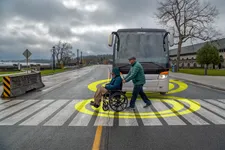 Wheelchair interacting with a bus	