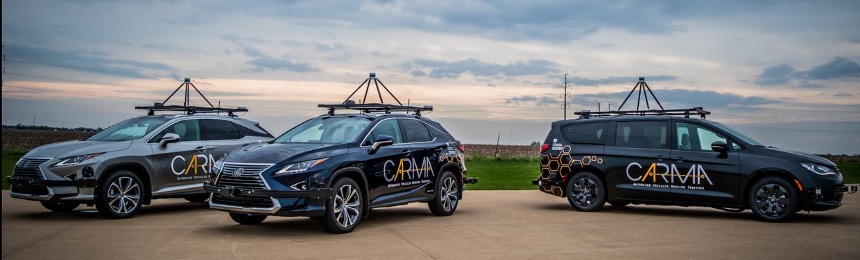Multiple vehicles equipped with CARMA and CARMA printed on the side