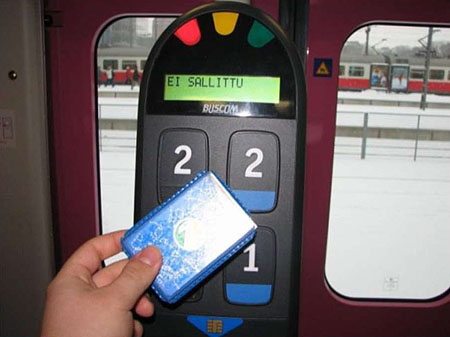 This photograph depicts a transit payment device from Finland using a contactless smart card. Please see the Extended Text Description below.