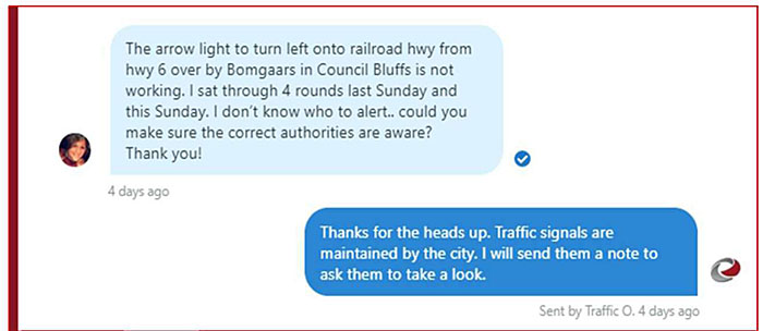 Screenshot photo of Twitter response from Iowa DOT responding to 100% of Twitter comments within 15 minutes, showing an example text of a Twitter user posting a message about an arrow light not working to a thank you response the same day from the Iowa DOT indicating that a note has been sent to the appropriate department to look into the report of the light not working.