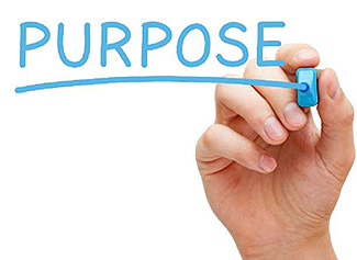 The lower right corner of this slide includes an image of a hand writing the word “Purpose” with a light blue marker.