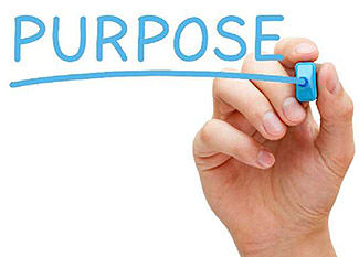 The lower right corner of this slide includes an image of a hand writing the word “Purpose” with a light blue marker.